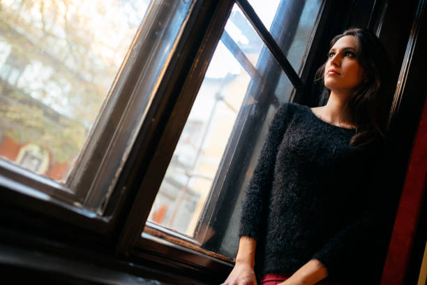istock Pretty woman looking out the window 662056930