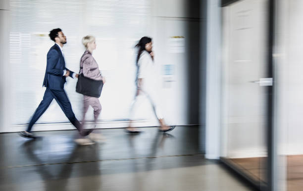 istock Business people walking along the corridor 662059666