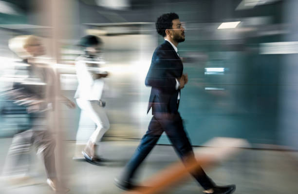 istock Business people walking along the corridor 662059700