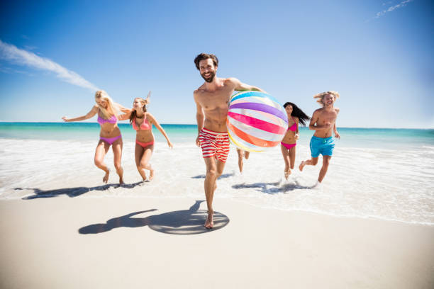 istock Friends having fun at the beach 662059830