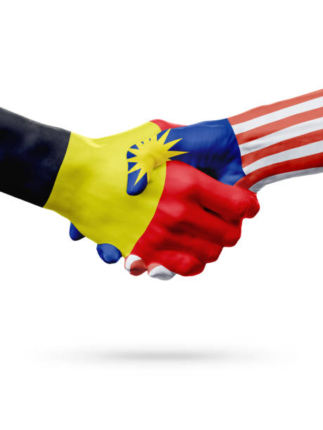 istock Flags Belgium, Malaysia countries, partnership friendship handshake concept. 662095378