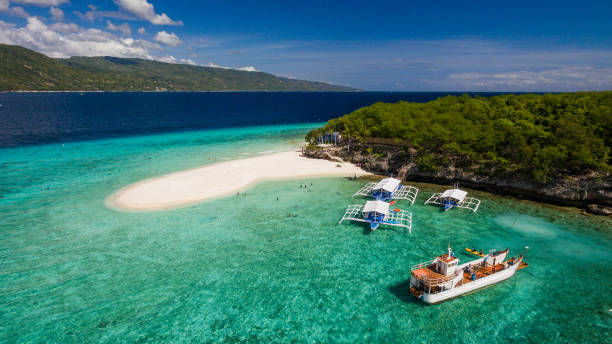Island An aerial perspective of the beach landing near Oslob, Cebu, Philippines. cebu province stock pictures, royalty-free photos & images