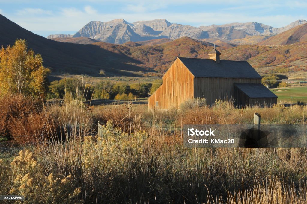 Fall at Tate Barn Historic Tate Barn in the fall with Mount Timpanogas in the background, Midway, Utah Utah Stock Photo