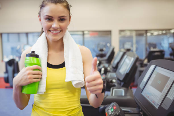 istock Fit woman using the treadmill 662125216