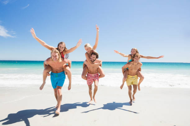 istock Friends having fun at the beach 662125466