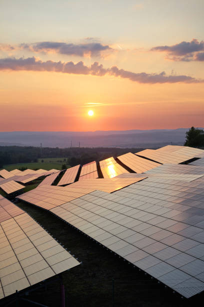 istock Sunset over solar power plant in countryside. View from above. 662133076