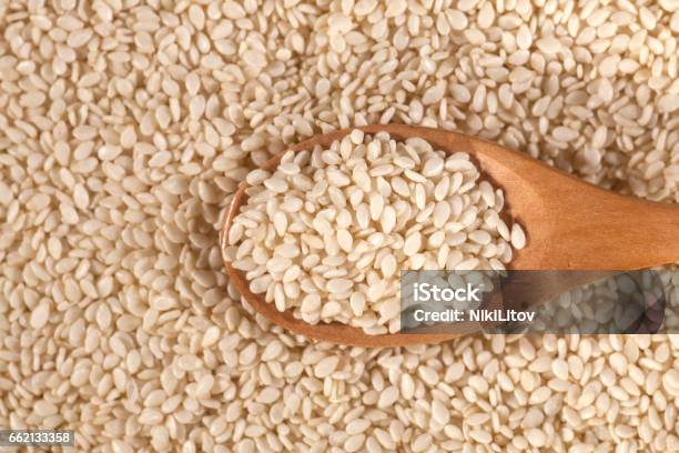 Background Of Fresh Sesame Seeds In Wooden Spoon Stock Photo - Download Image Now - Agriculture, Aromatherapy, Aromatherapy Oil