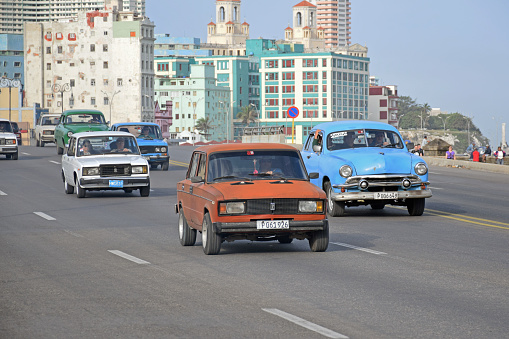 Cairo, Egypt, August 22 2023: Cairo is served by its white taxis which have been introduced in the early 2010s and aren't run by a company, but by individuals, a white Hyundai Verna Cairo Taxi, selective focus