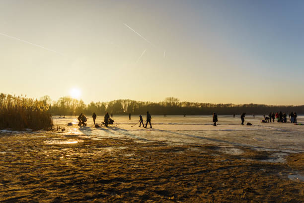 istock sunset over a frozen lake 662167416