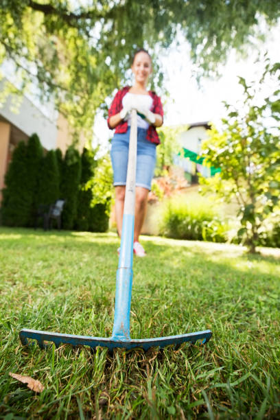 istock Young woman gardening outside 662168018