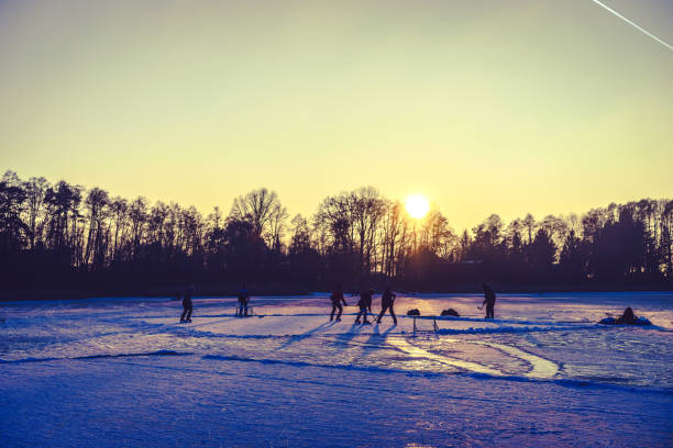 istock sunset over a frozen lake 662168458