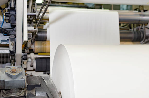 istock A large webset offset printing press running a long roll off paper over its rollers at high speed 662173772