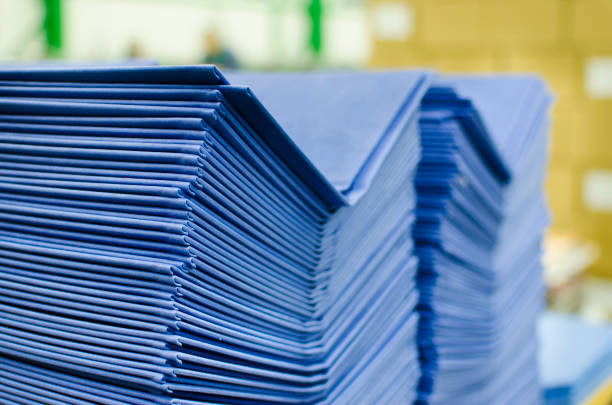 istock Many hard book covers stacked in a pile in offset pring production plant 662174878
