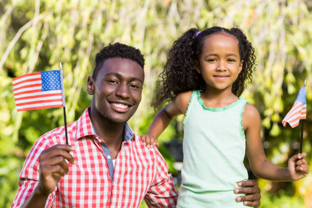istock Happy family showing usa flag 662201854
