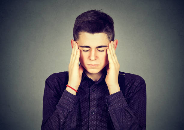 istock Closeup portrait sad young handsome man with worried stressed face expression looking down 662211418
