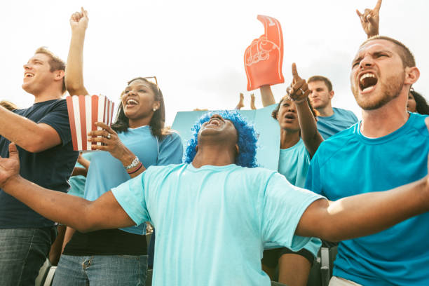istock Crowd of fans cheering from stadium bleachers 662252986
