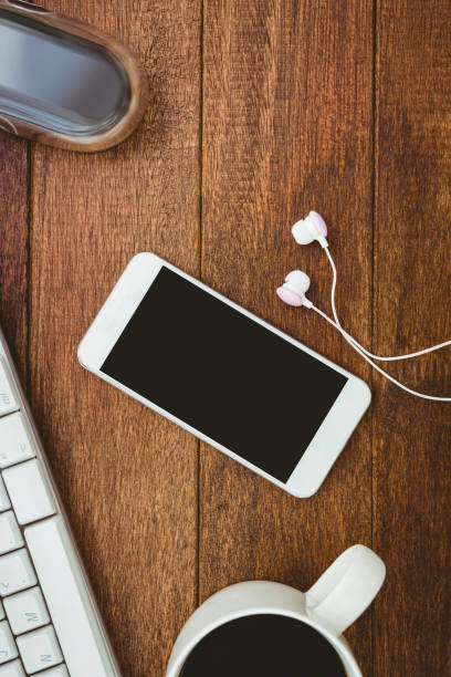 istock White smartphone with cup of coffee 662265740