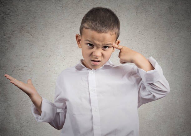 istock Closeup portrait angry mad child boy gesturing with his finger 662267596