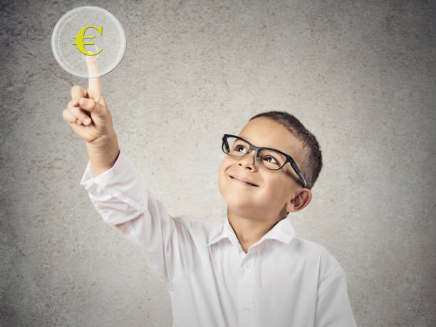 istock Closeup portrait happy boy with glasses pushing digital button 662269726