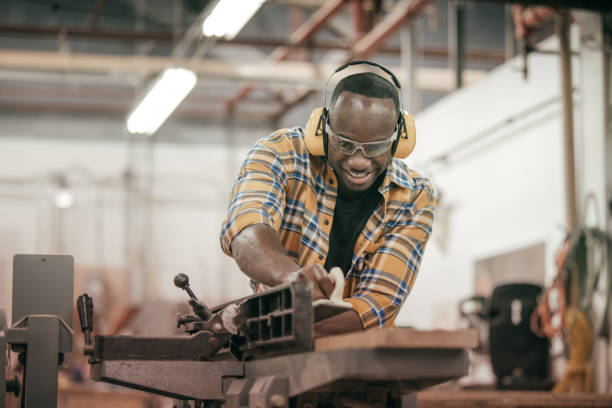 istock Male carpenter working with power tools in his wood shop 662279288