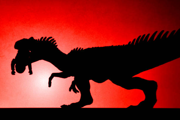 istock red spot light shadow of allosaurus biting a body 662290360