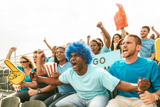 istock Crowd of fans cheering from stadium bleachers 662292370