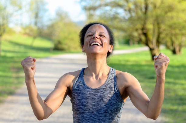 istock Young african woman cheering 662360994