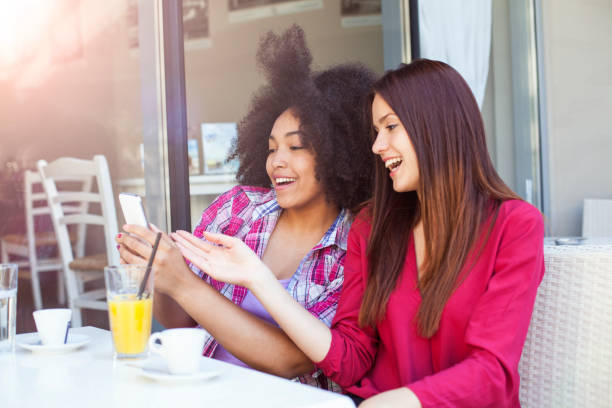 istock Two young girls talking during lunch break 662446576