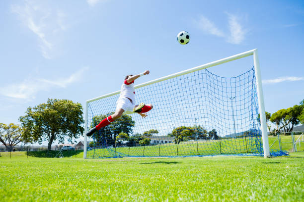 istock Football player scoring a goal 662455434