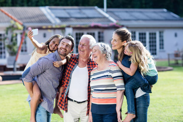 istock Multi-generation family taking a selfie in garden 662498768