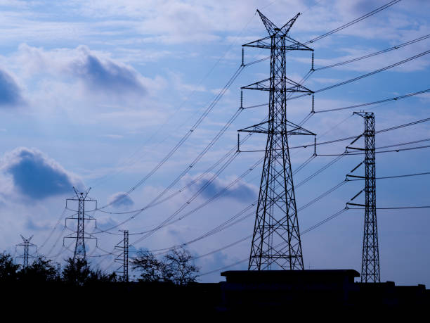 istock high voltage electric pole isolated in blue sky background 662545236