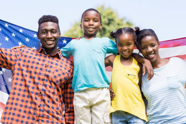 istock Happy family showing usa flag 662548954