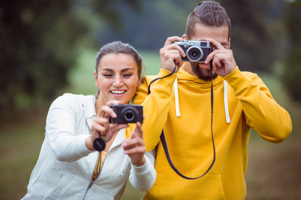 istock Happy couple taking photos to camera 662555900