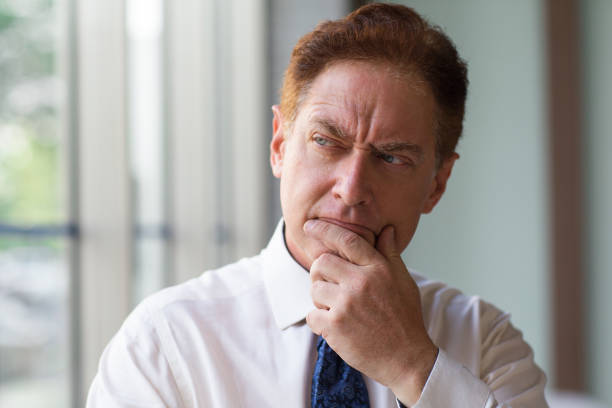 istock Reflective male CEO rubbing chin when he thinking 662564266