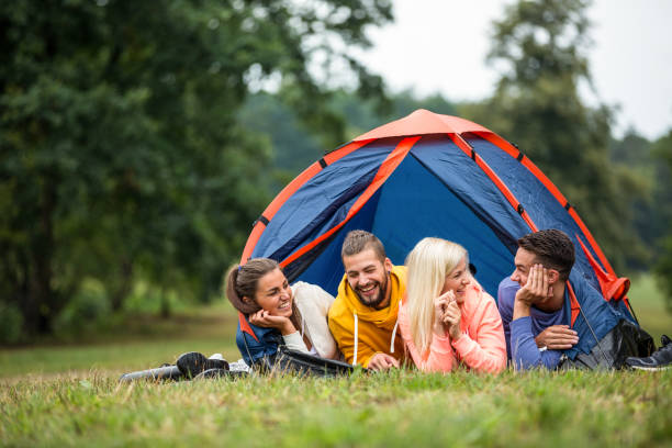 istock Happy friends lying in their tent 662571206