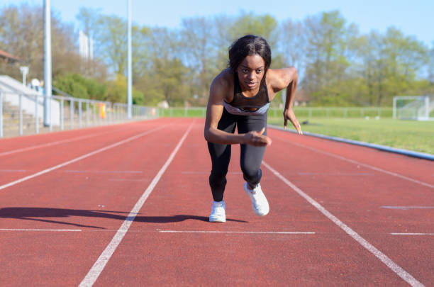 istock Woman doing sprint training on a sports track 662605196