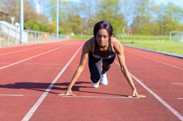 istock Woman doing sprint training on a sports track 662606798