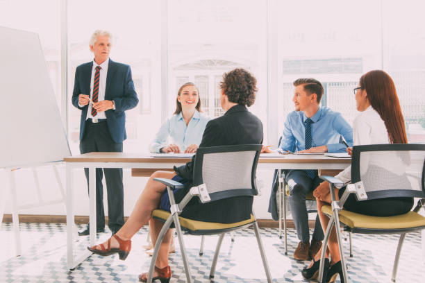 istock Business coach holding training for staff_tone 662607338