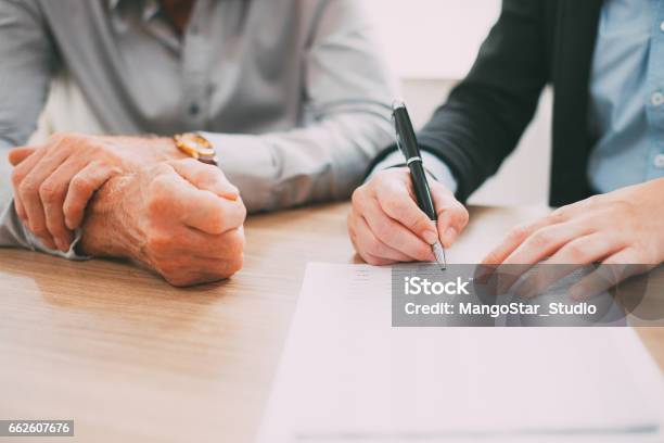 Unrecognizable Woman Signing Contract At Meetingtone Stock Photo - Download Image Now