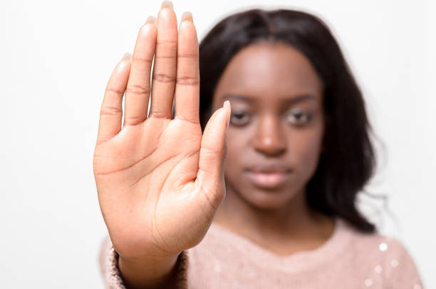 istock Stern young woman making a halt gesture 662608654
