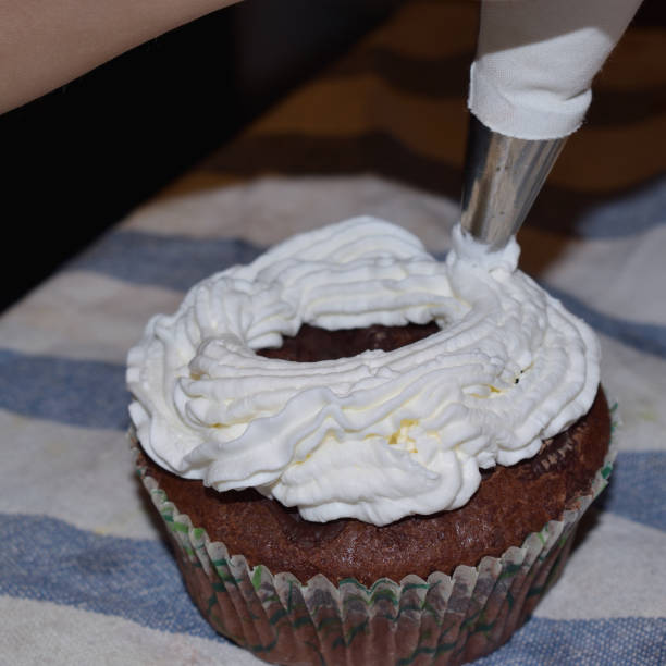 istock cup cakes with cream and various colorful decorations 662610468