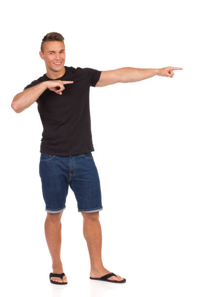 istock Handsome Casual Man Smiling And Pointing 662611842
