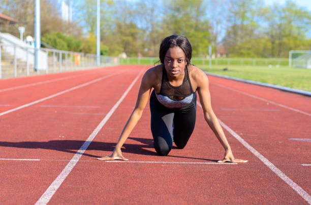istock Woman doing sprint training on a sports track 662612638