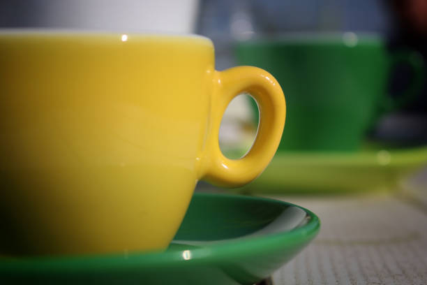 istock Green and yellow cup of coffee 662625242