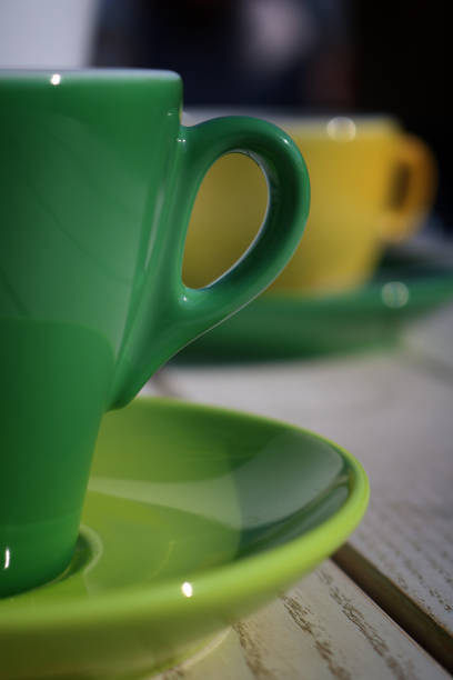 istock Green and yellow cup of coffee 662625490