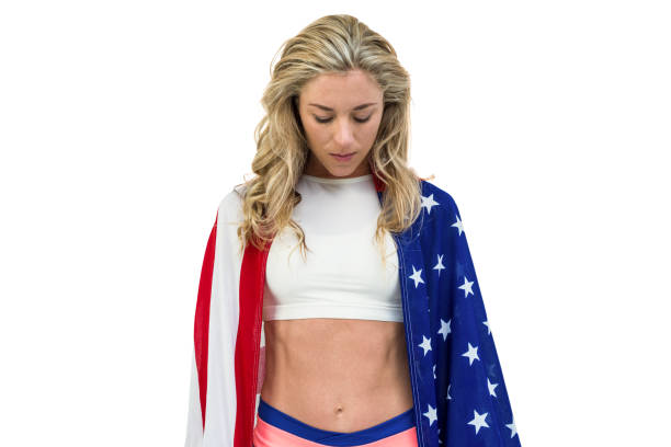 istock Athlete with american flag wrapped around his body 662797178