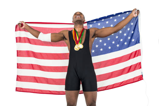 istock Athlete posing with gold medals after victory 662860458