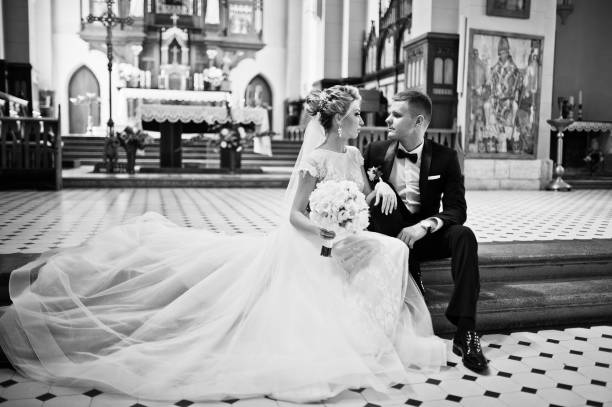 istock Wedding couple at catholic church 662882846
