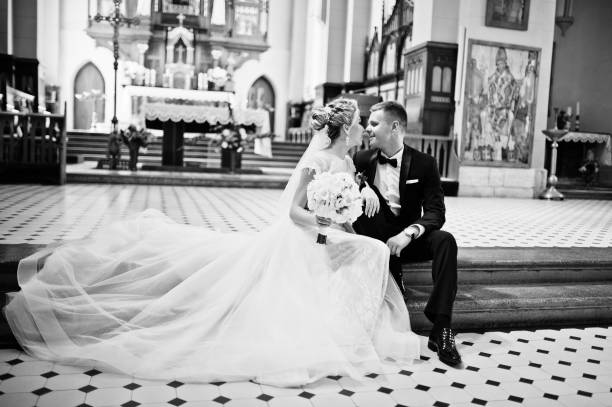 istock Wedding couple at catholic church 662882860