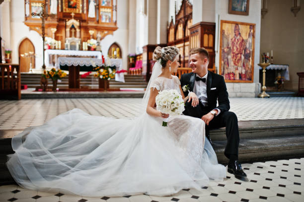 istock Wedding couple at catholic church 662882864